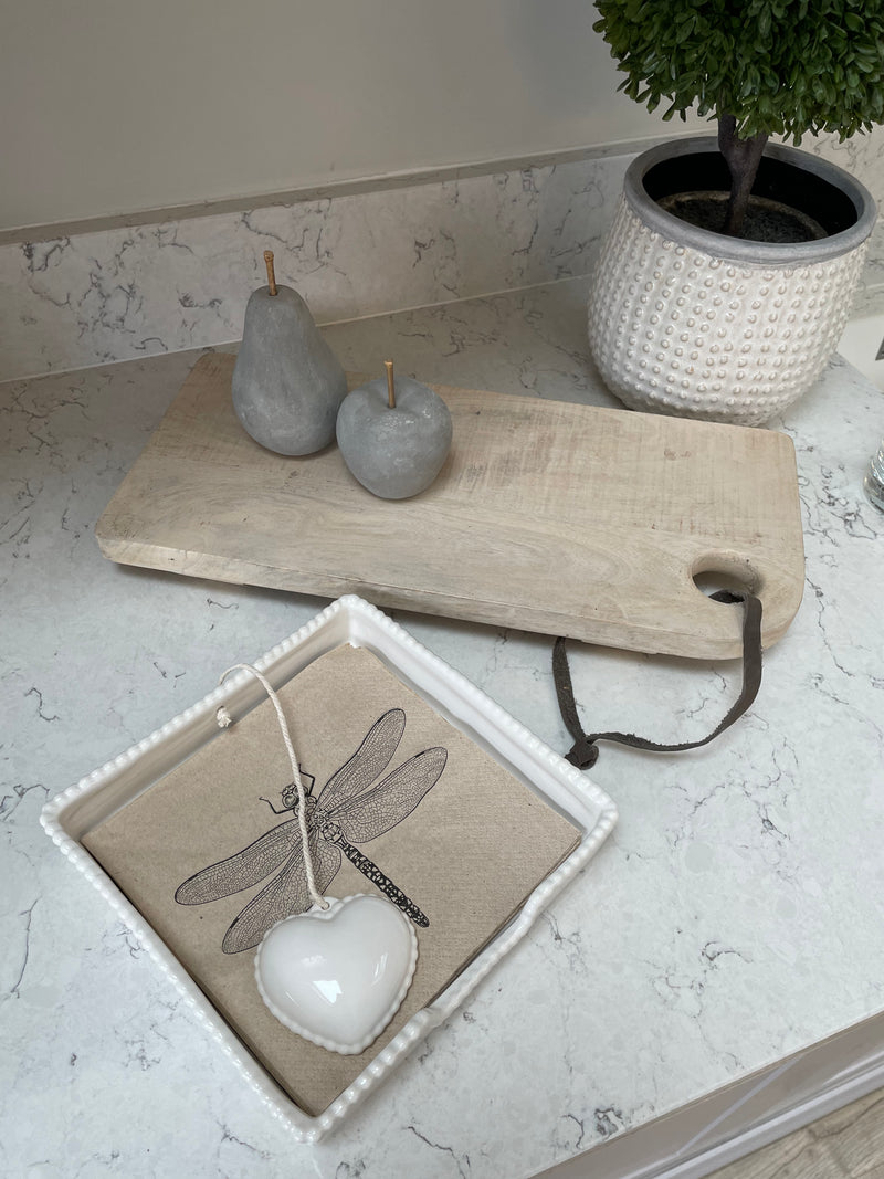 White ceramic napkin holder with weight