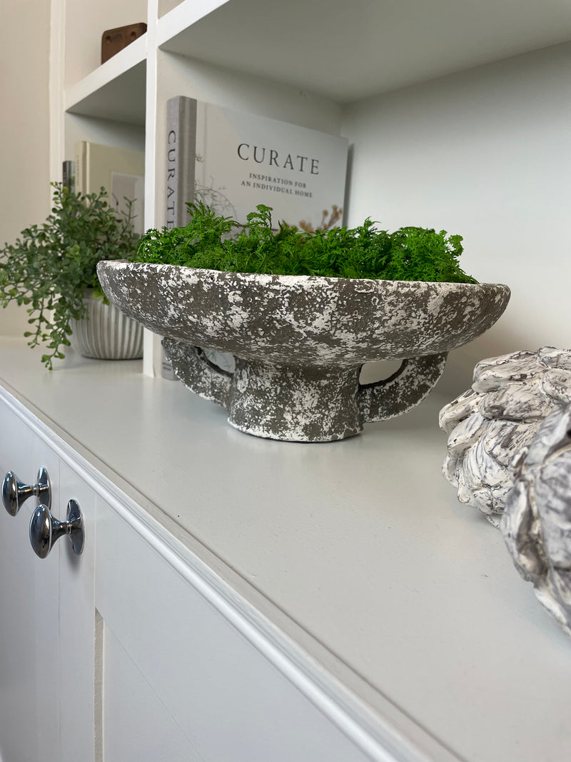 Round rustic stone bowl on foot base