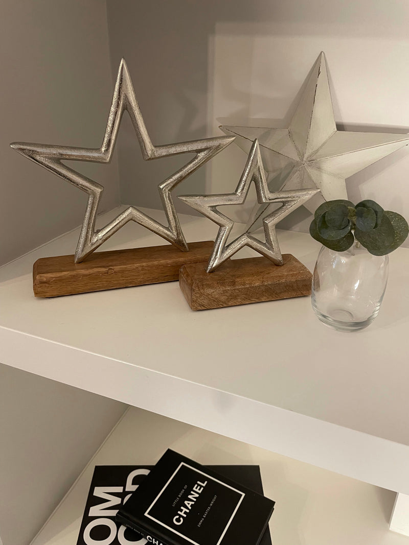 Medium aluminium star on wood block 22cm