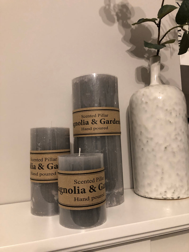 Small scented pale grey pillar candle 10x7cm