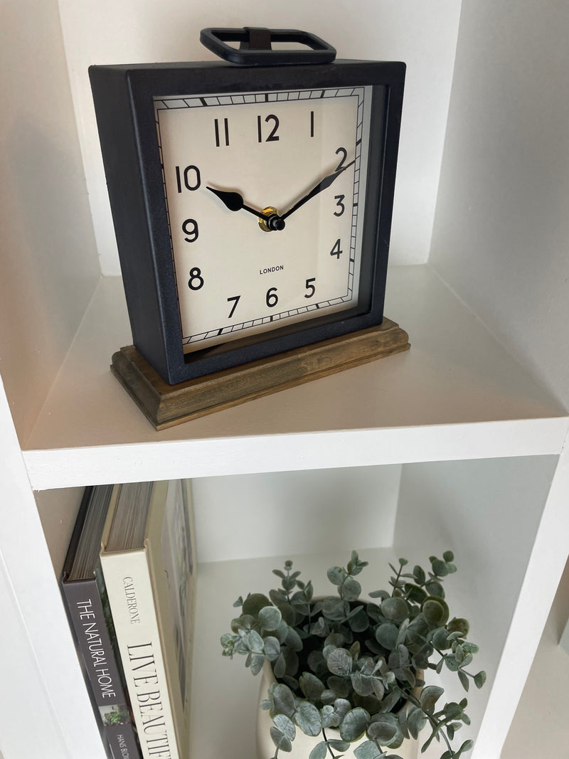 Black wooden based metal clock