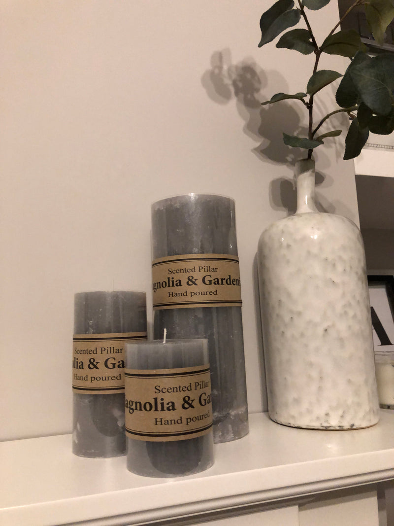 Small scented pale grey pillar candle 10x7cm