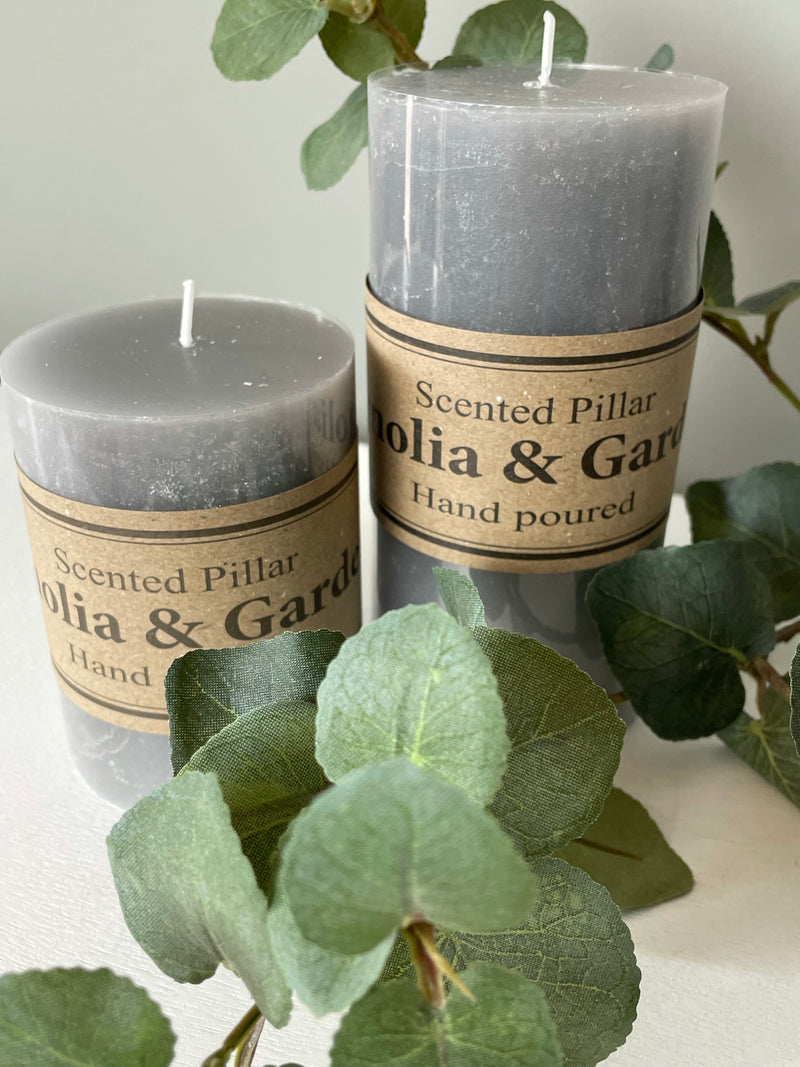 Small scented pale grey pillar candle 10x7cm