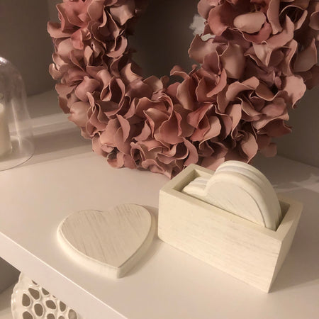 Set of 4 white wooden heart coasters in holder