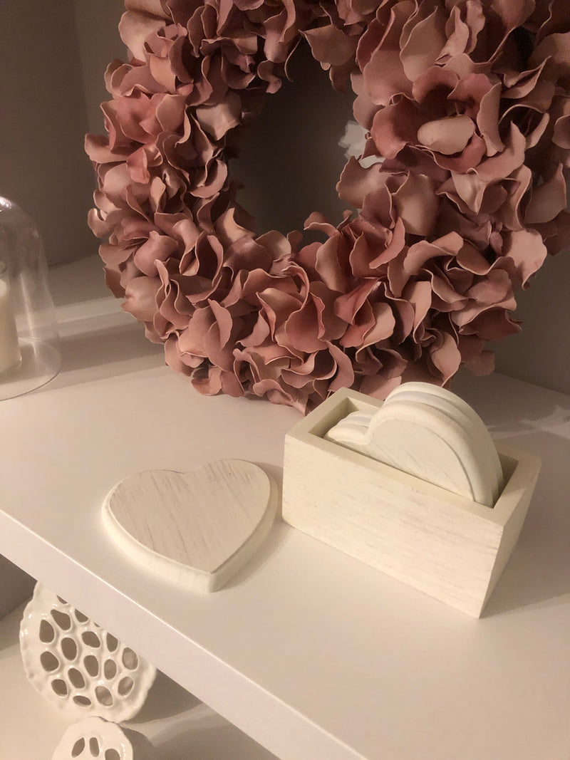 Set of 4 white wooden heart coasters in holder