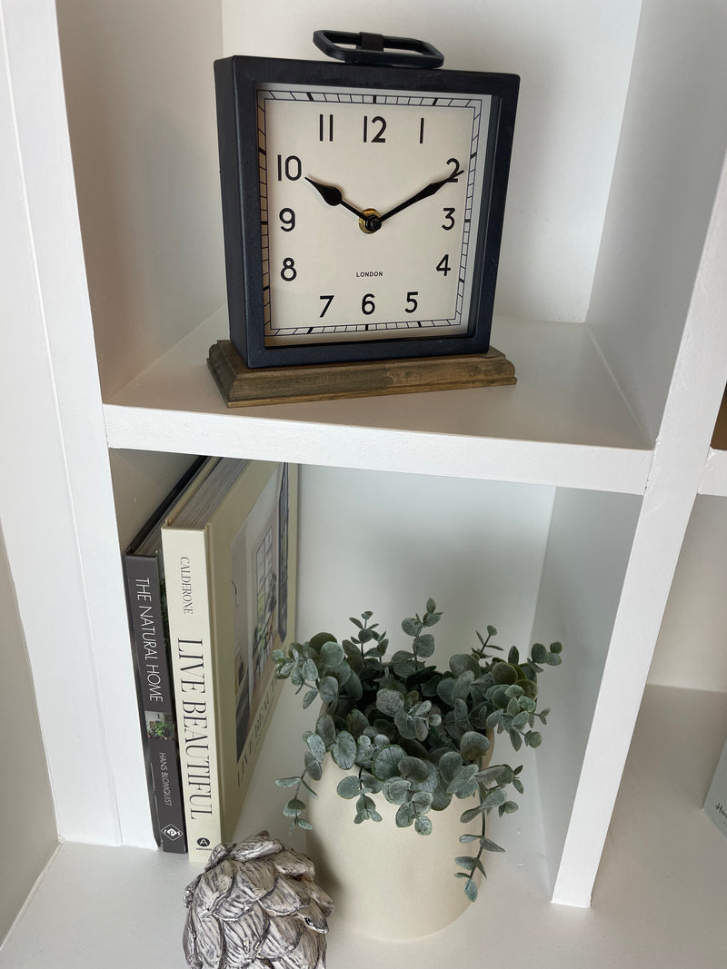 Black wooden based metal clock