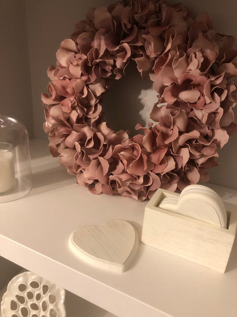 Set of 4 white wooden heart coasters in holder
