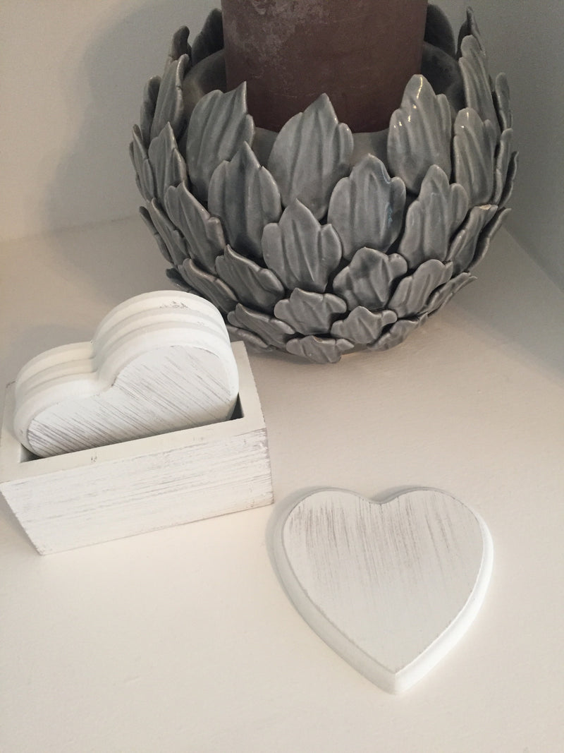 Set of 4 white wooden heart coasters in holder