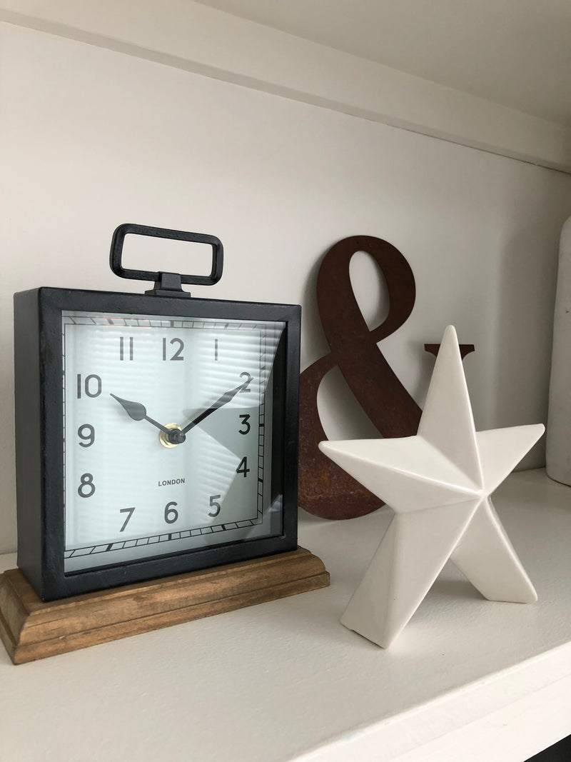 Black wooden based metal clock