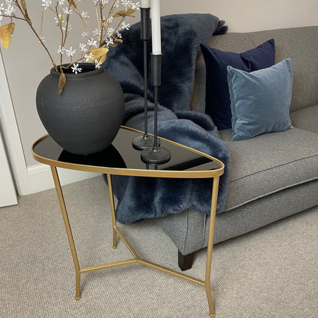 Large shaped metal gold side table with glass top