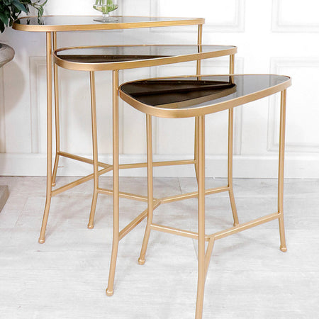 Large shaped metal gold side table with glass top