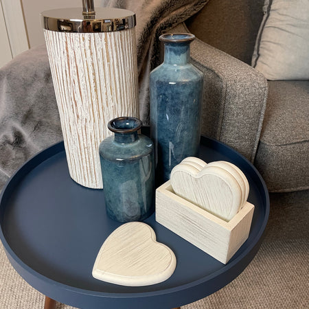 Set of 4 white wooden heart coasters in holder