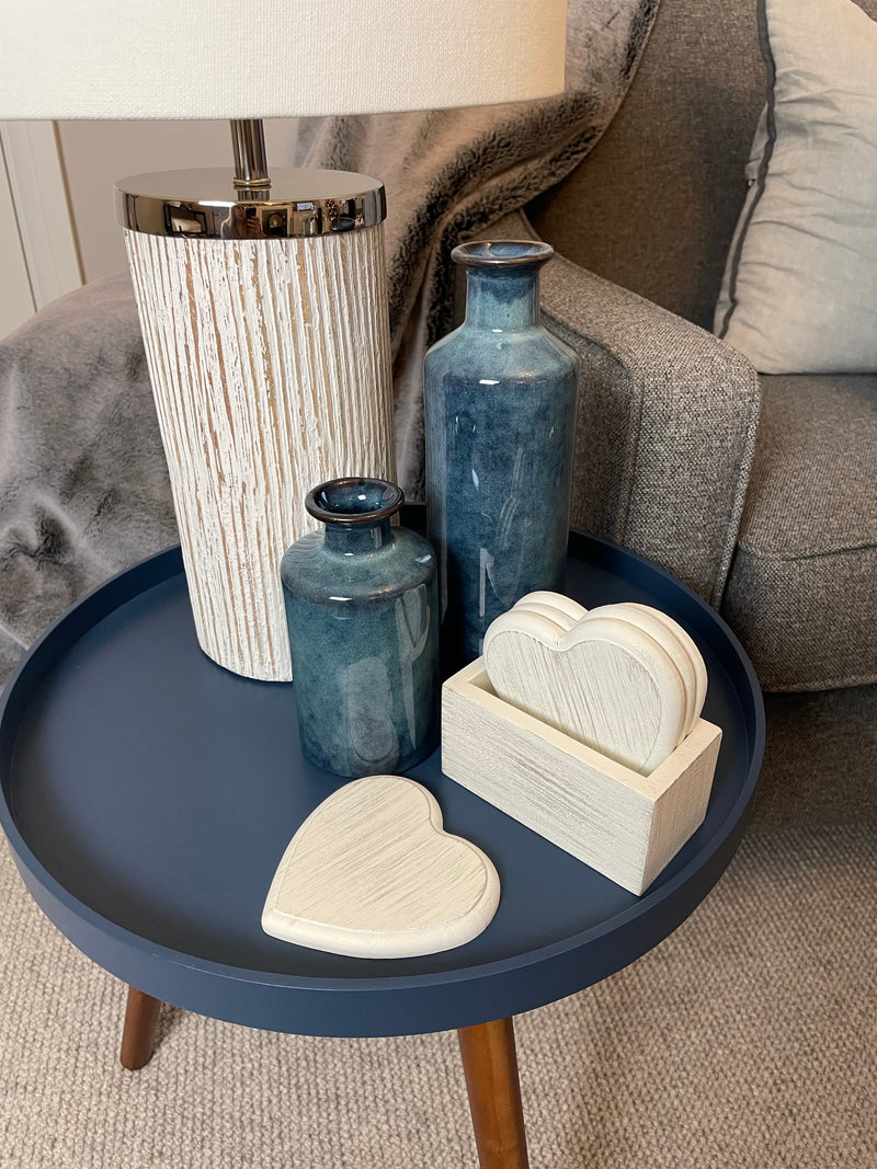 Set of 4 white wooden heart coasters in holder