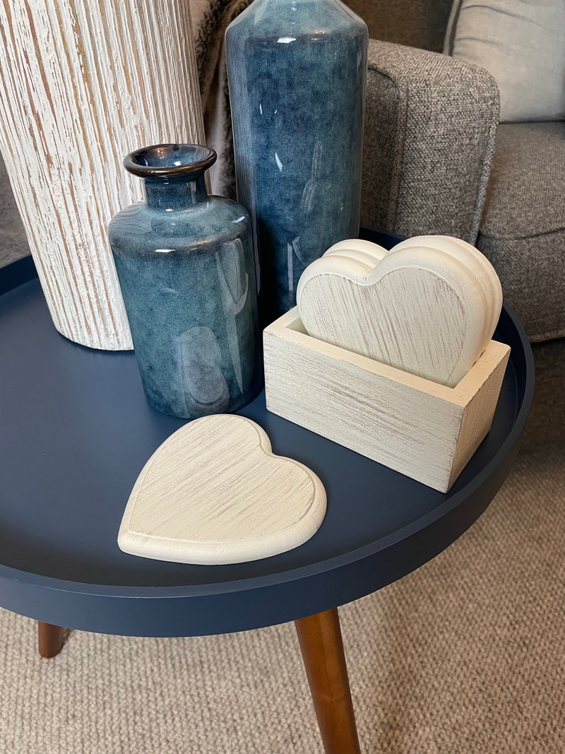 Set of 4 white wooden heart coasters in holder
