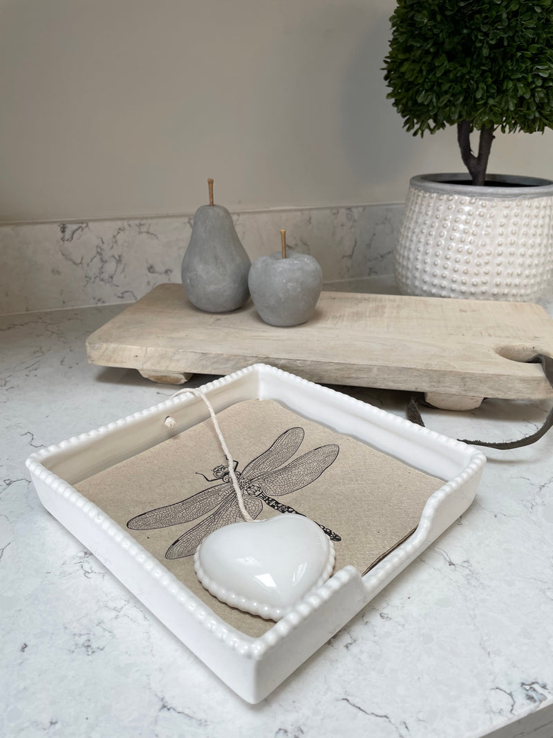 White ceramic napkin holder with weight