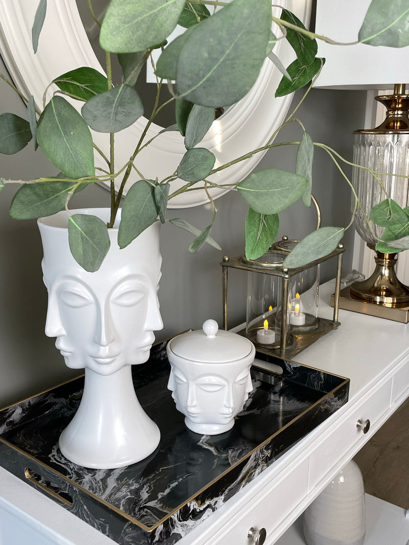 White faces ceramic lidded jar