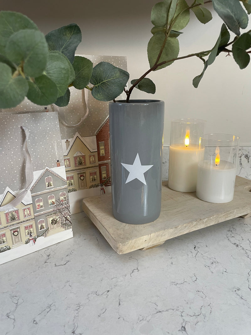 Grey ceramic vase with white star