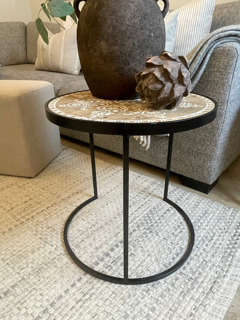 Black metal table with embossed wooden top