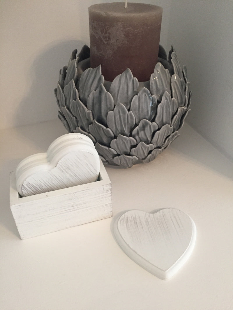 Set of 4 white wooden heart coasters in holder