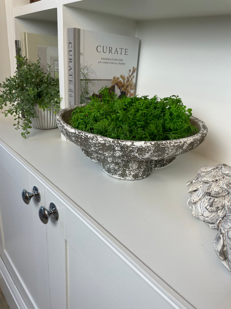 Round rustic stone bowl on foot base