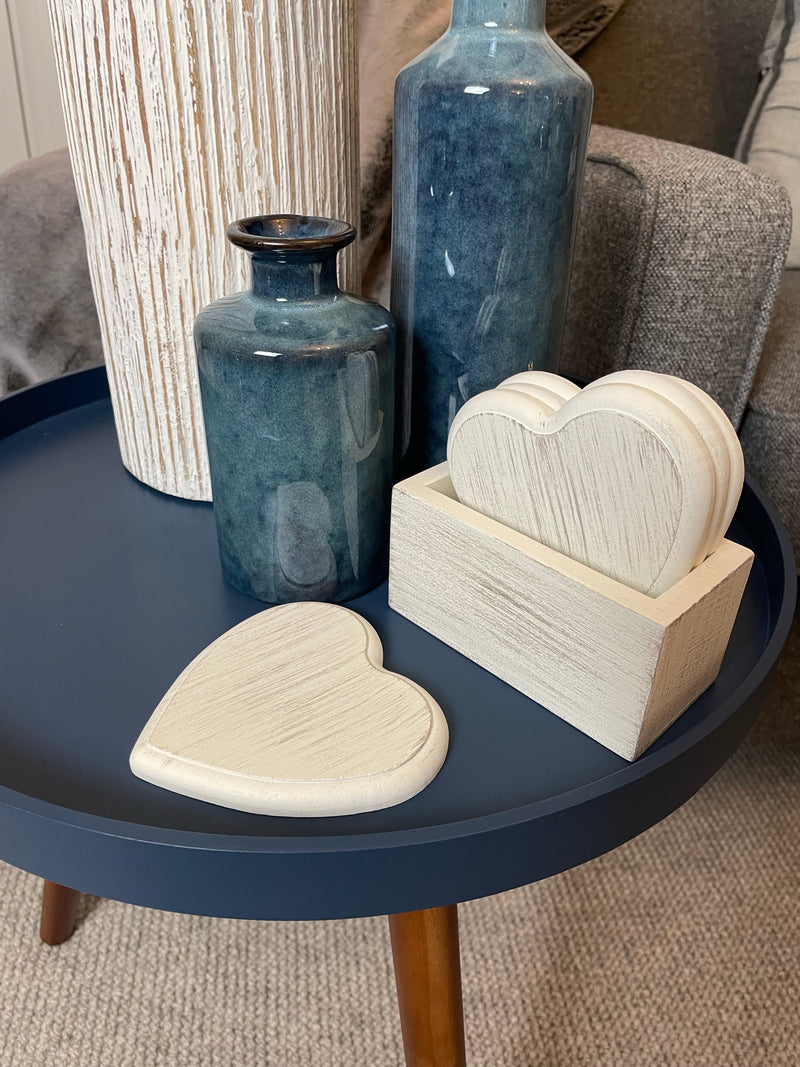Set of 4 white wooden heart coasters in holder