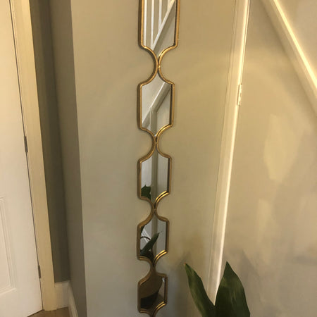 Tall slim gold decorative mirror