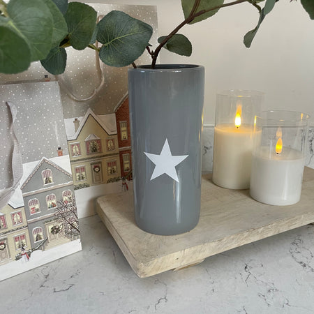 Grey ceramic vase with white star