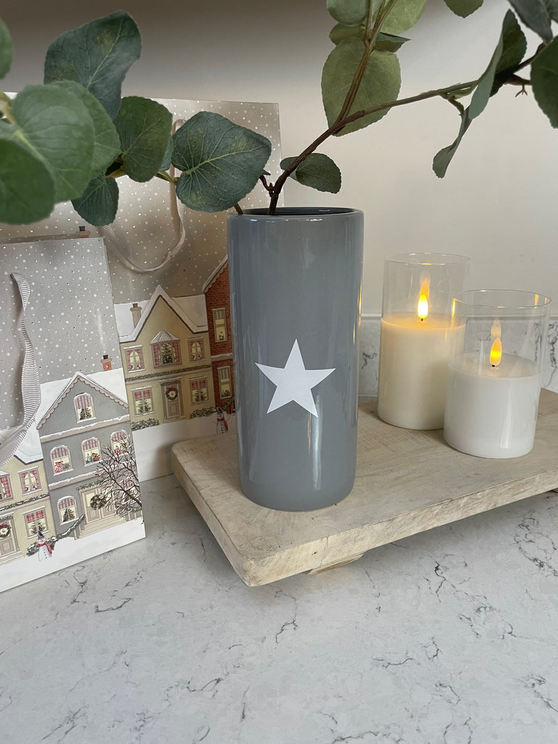 Grey ceramic vase with white star