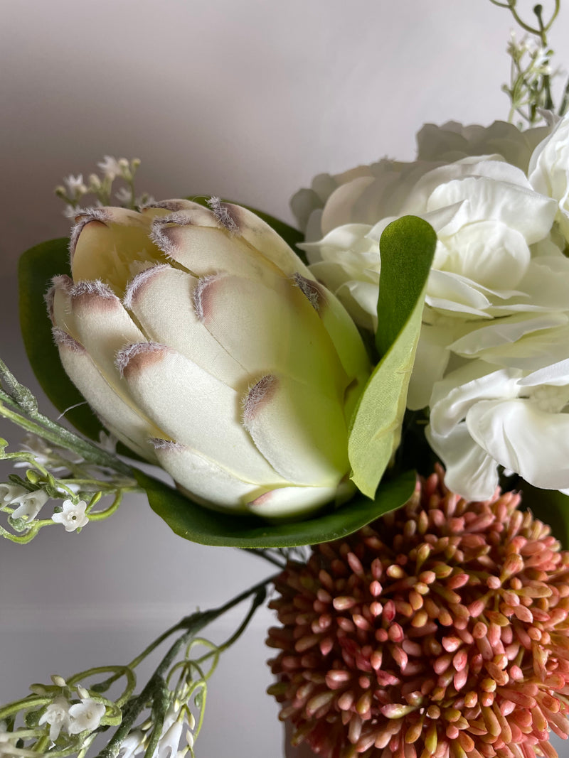Off white closed protea stem