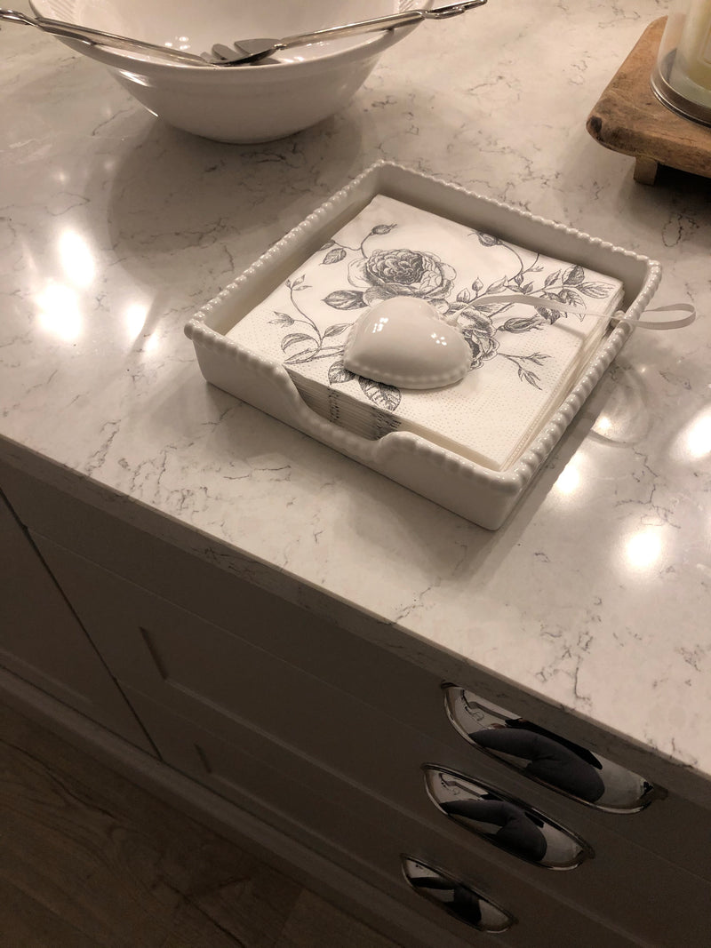 White ceramic napkin holder with weight