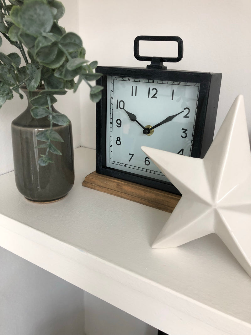 Black wooden based metal clock
