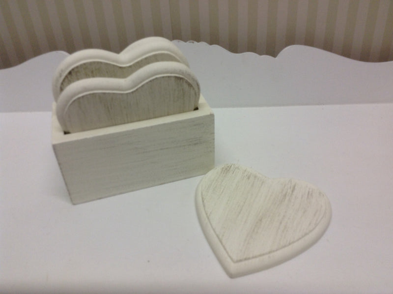 Set of 4 white wooden heart coasters in holder