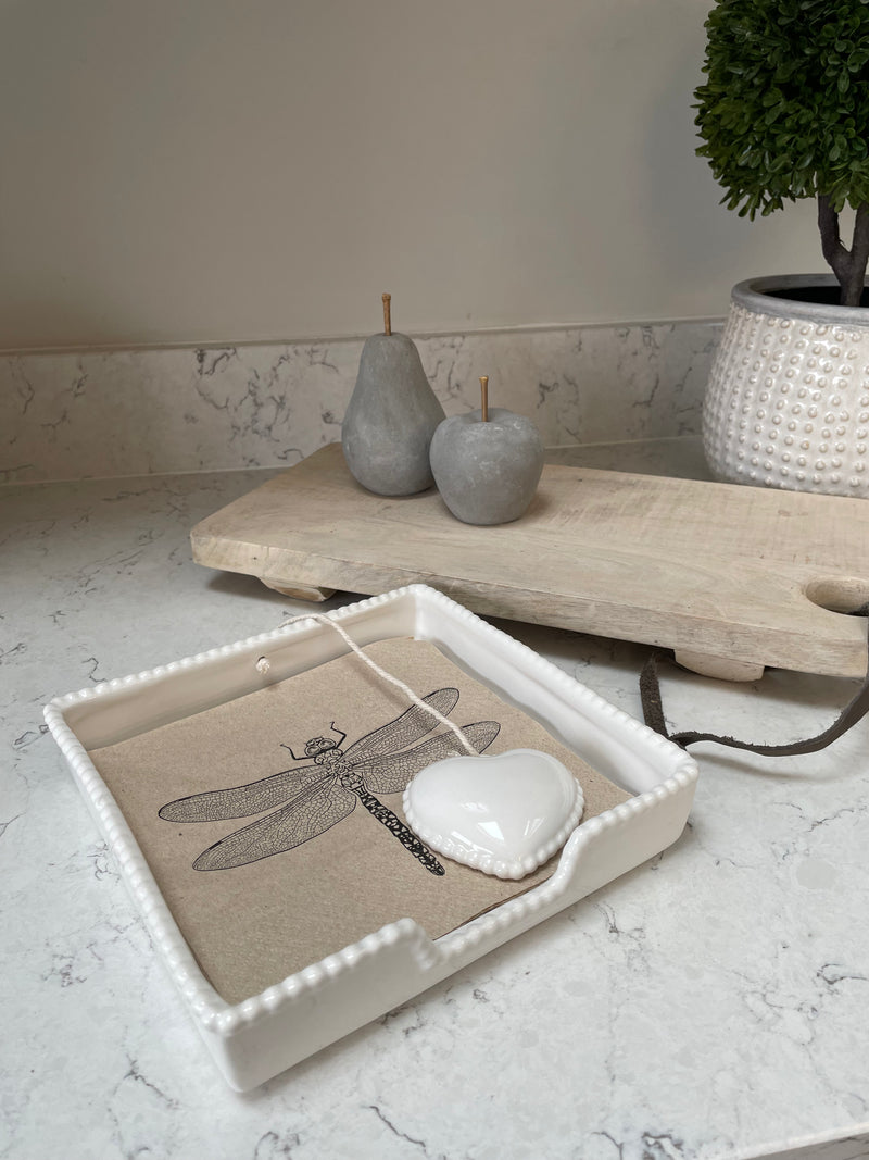 White ceramic napkin holder with weight