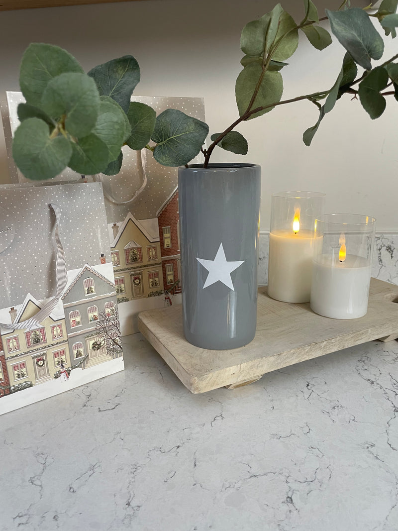 Grey ceramic vase with white star