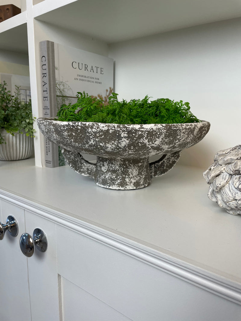Round rustic stone bowl on foot base