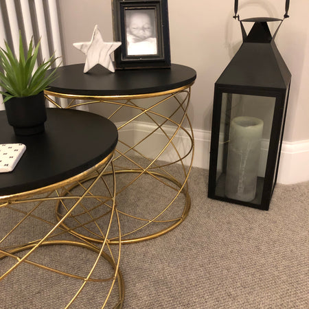 Medium gold side table with black top