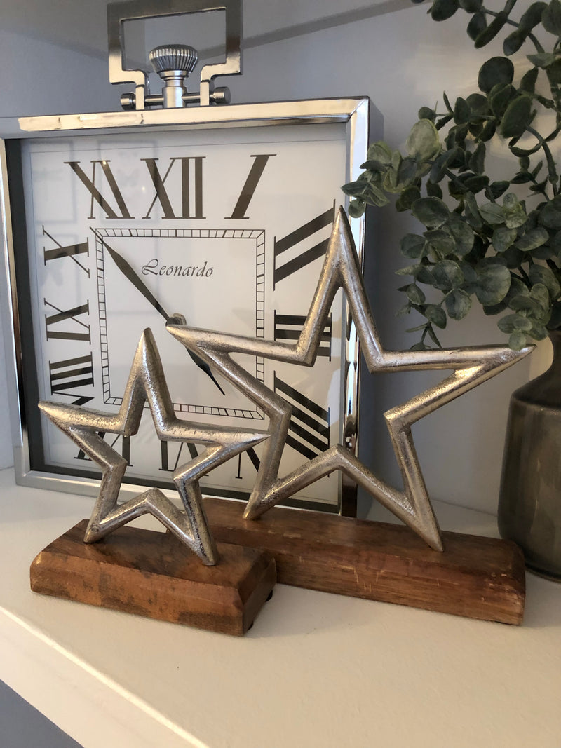 Medium aluminium star on wood block 22cm