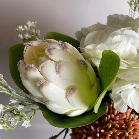 Off white closed protea stem