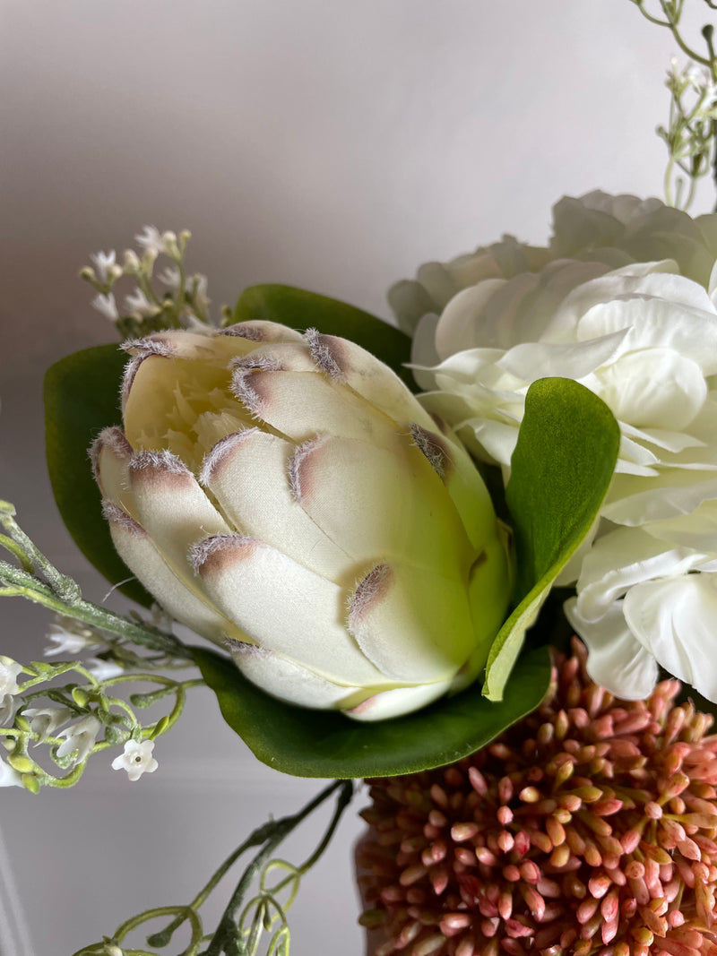 Off white closed protea stem