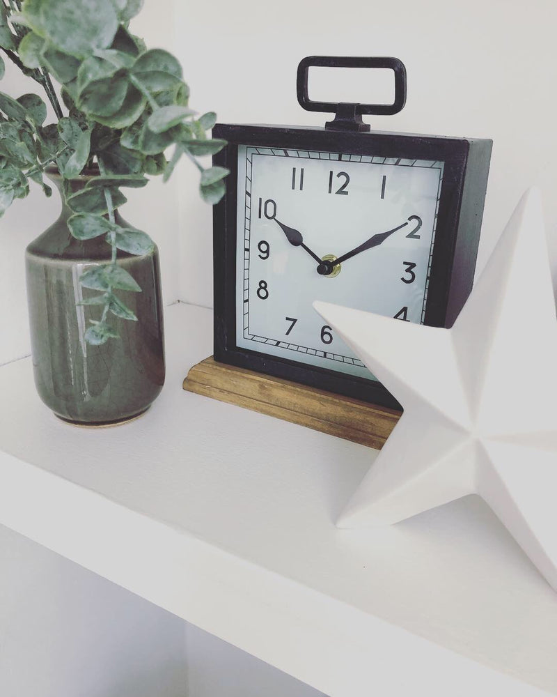 Black wooden based metal clock