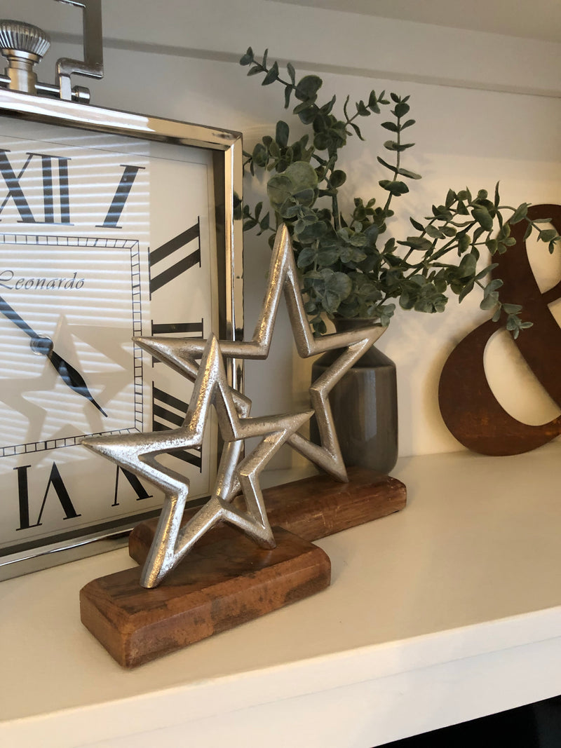 Medium aluminium star on wood block 22cm