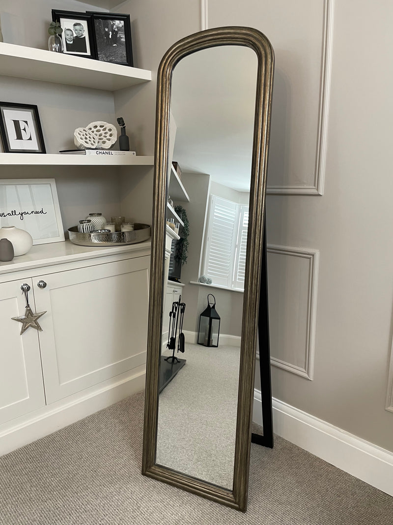 Brass arched floor standing mirror Abode