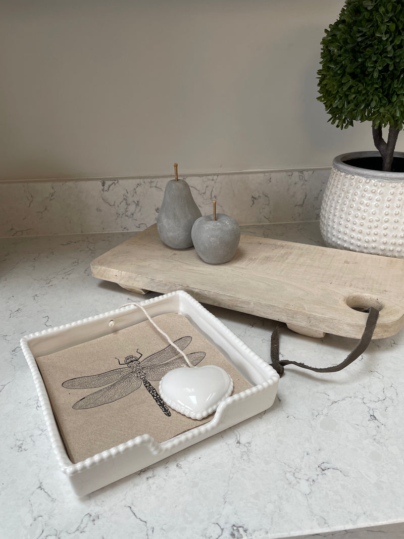 White ceramic napkin holder with weight