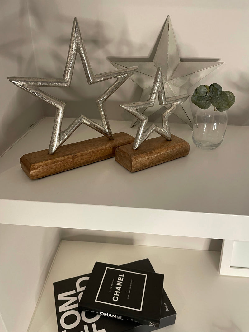 Medium aluminium star on wood block 22cm