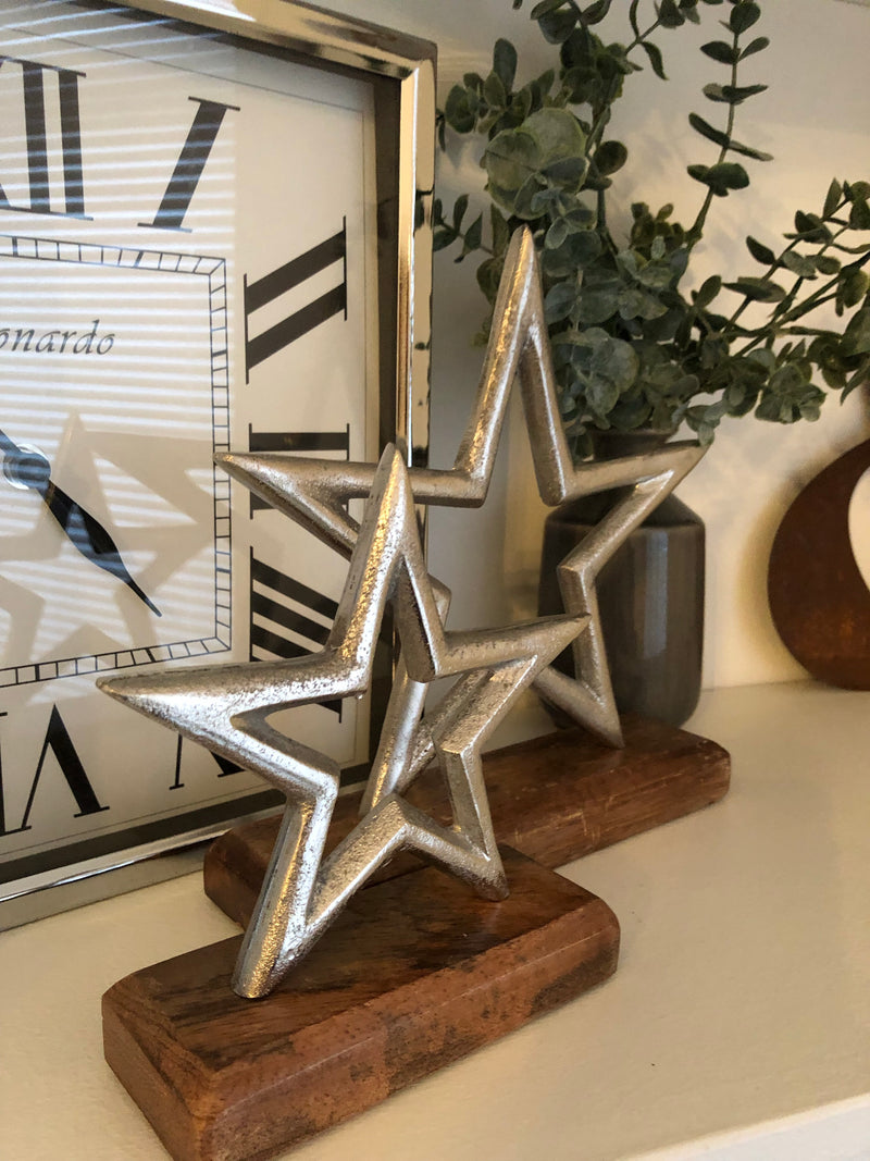 Medium aluminium star on wood block 22cm