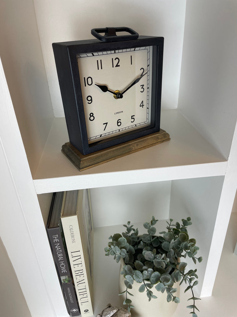 Black wooden based metal clock