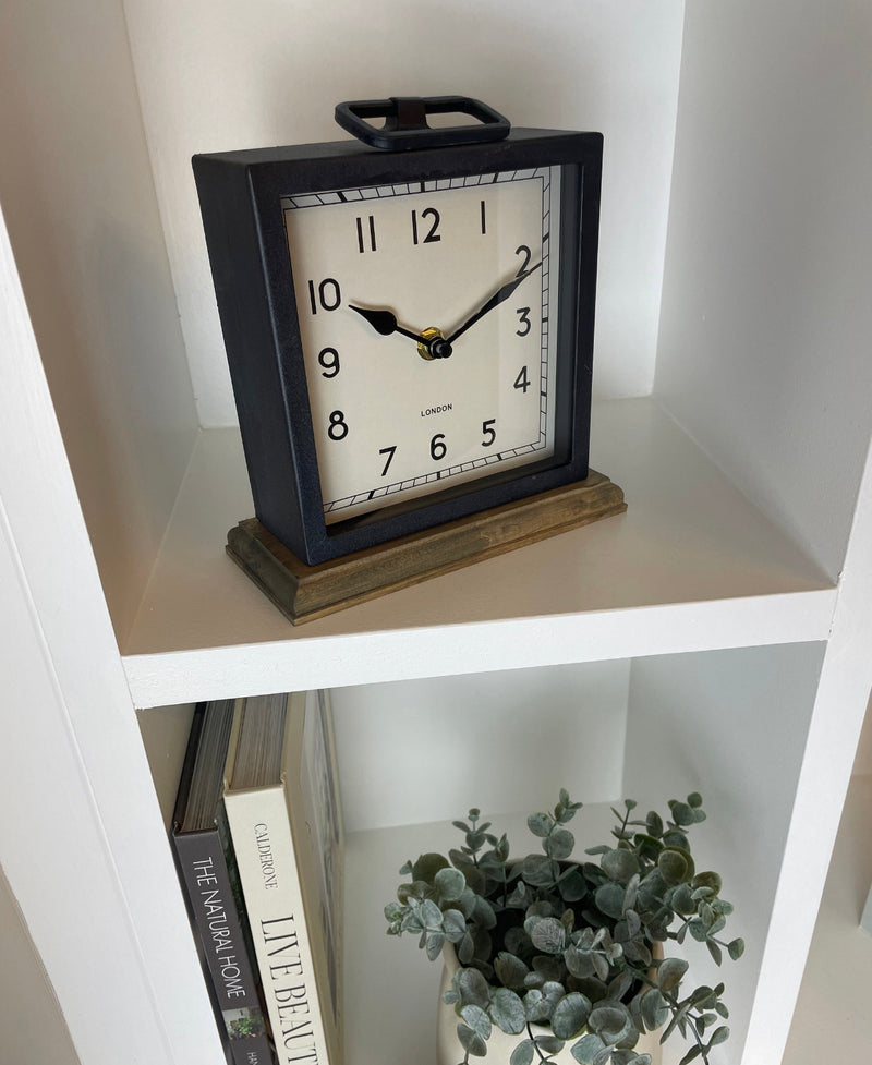 Black wooden based metal clock