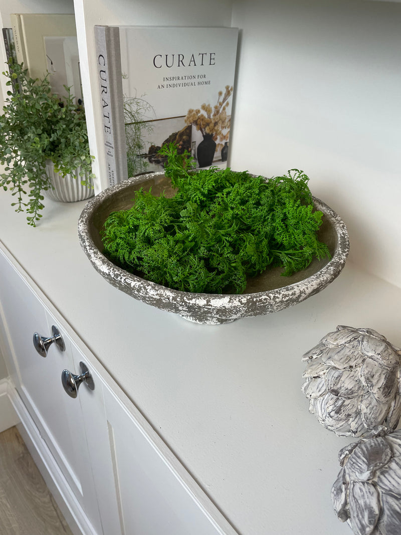 Round rustic stone bowl on foot base