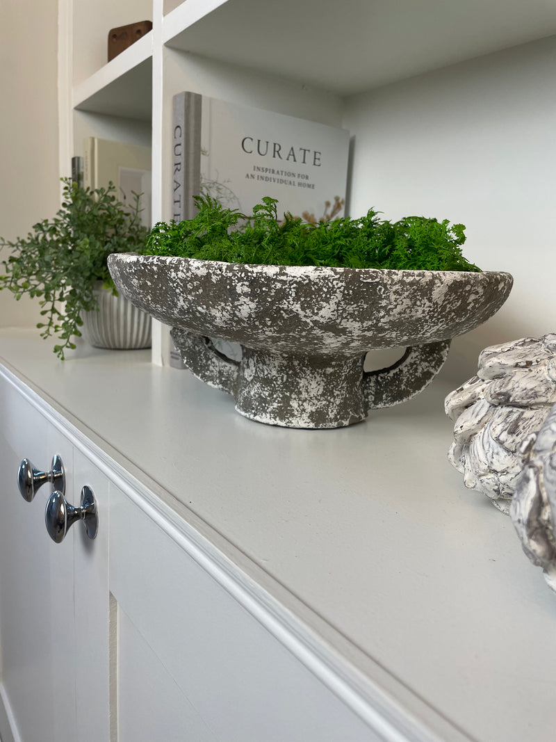Round rustic stone bowl on foot base