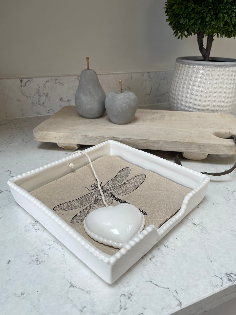 White ceramic napkin holder with weight